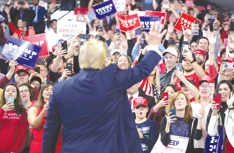 US PRESIDENT Donald Trump waves to supporters during a campaign rally in Milwaukee, Wisconsin, Tuesday. (photo credit: KEVIN LAMARQUE/REUTERS)