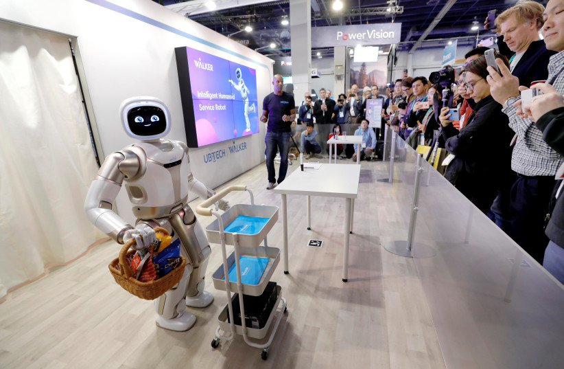 A ROBOT GIVES a demonstration at a tech conference in Las Vegas on January 8. The book explores the leaps forward and backward in robot technolog (photo credit: REUTERS)