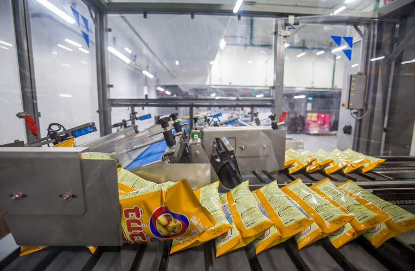 Packets of Bamba are seen at Osem's Kiryat Gat manufacturing plant  (photo credit: OSEM)