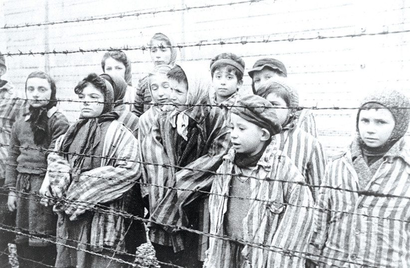YOUNG SURVIVORS of Auschwitz – how do you explain the inhumanity of the Nazis and their collaborators in the past, and the burning hate of antisemites in the present? (photo credit: Wikimedia Commons)