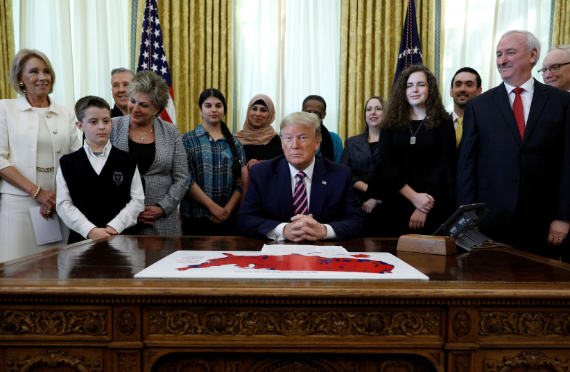 U.S. President Donald Trump holds an event to announce new guidance on constitutional prayer in public schools inside the Oval Office at the White House in Washington, U.S., January 16, 2020. (photo credit: REUTERS/TOM BRENNER)