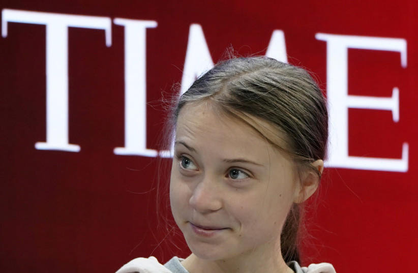 Swedish climate change activist Greta Thunberg attends the 50th World Economic Forum (WEF) annual meeting in Davos, Switzerland, January 21, 2020. (photo credit: DENIS BALIBOUSE / REUTERS)