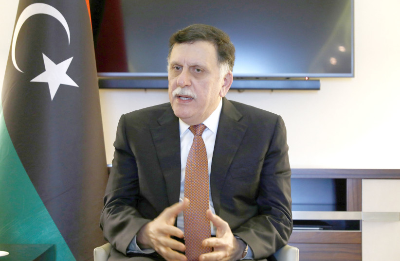 LIBYAN PRIME MINISTER Fayez Mustafa Al-Sarraj is pictured during an interview in Berlin on January 20.  (photo credit: REUTERS)