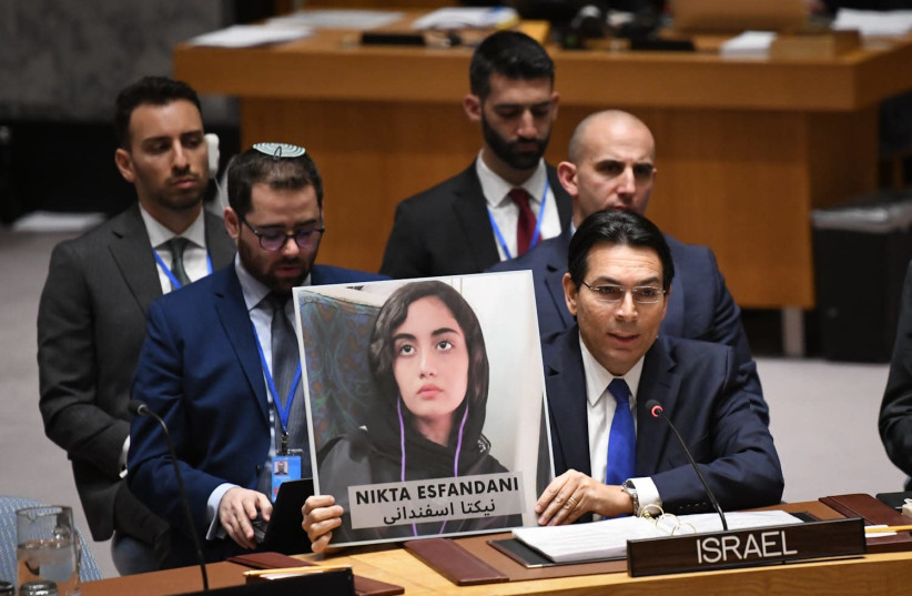 Israel ambassador to the UN, Danny Danon, holds up a picture of Nikta Esfandani, age 14, who was shot and killed by the Iranian regime, January 21, 2020 (photo credit: COURTESY OF THE ISRAELI MISSION AT UN)