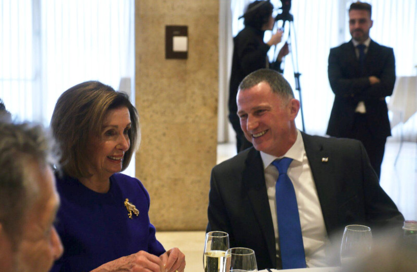 Speaker of the US House of Representatives Nancy Pelosi and Knesset Speaker Yuli Edelstein share a joke over lunch, January 22, 2020 (photo credit: KNESSET PRESS SERVICE/ADINA VALMAN)