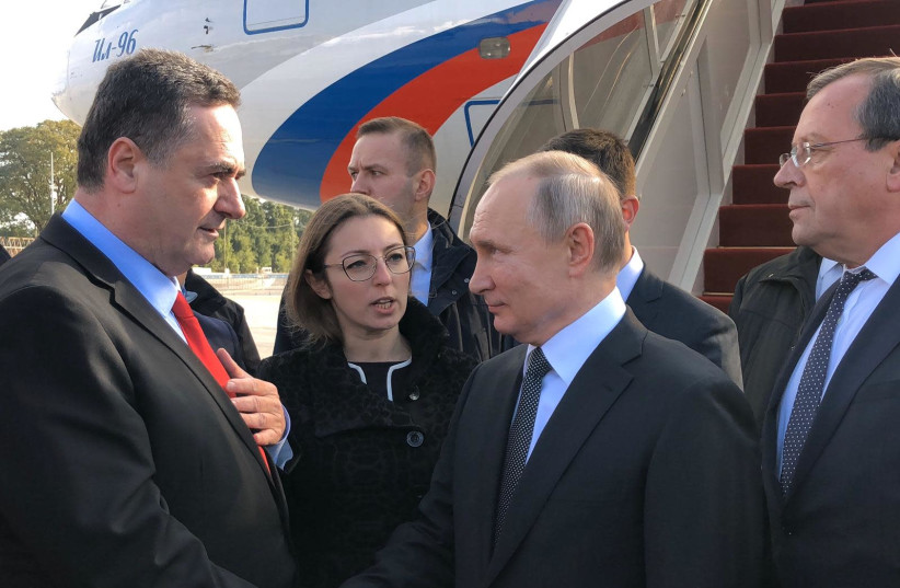 Russian President Vladimir Putin is greeted by Israel's Foreign Minister Israel Kazt after landing at ben-Gurion Airport, January 23, 2020 (photo credit: Courtesy)