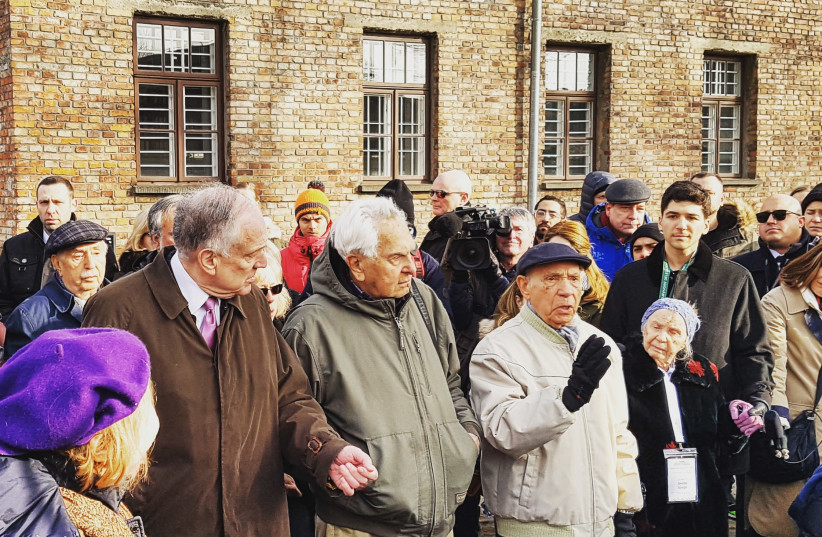 Several Holocaust survivors address the press at Auschwitz together with WJC president and Auschwitz-Birkenau Memorial Foundation chairman Ronald S. Lauder. (credit: ILANIT CHERNICK)