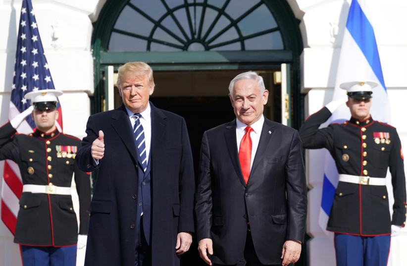 U.S. President Donald Trump gestures as he welcomes Israel's Prime Minister Benjamin Netanyahu at the White House in Washington, U.S., January 27, 2020. (photo credit: KEVIN LAMARQUE/REUTERS)