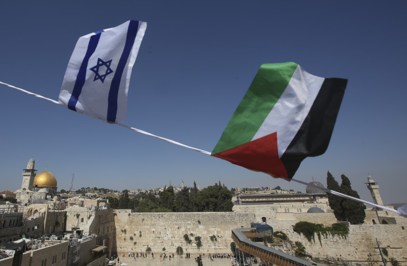Palestinian and Israeli flags overlook Dome of Rock and Western Wall (credit: MARC ISRAEL SELLEM/THE JERUSALEM POST)