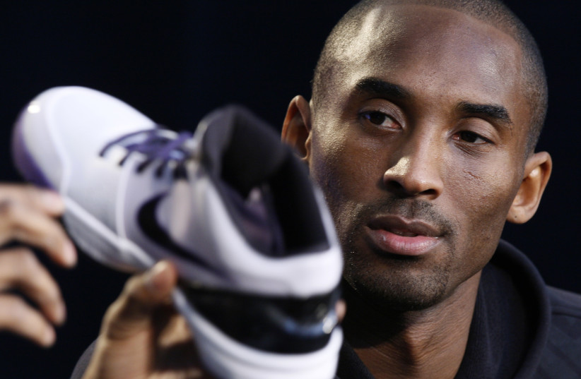 NBA Los Angeles Lakers star Kobe Bryant speaks at a webcast to unveil his new Nike Zoom Kobe IV basketball shoe in Los Angeles (photo credit: REUTERS)