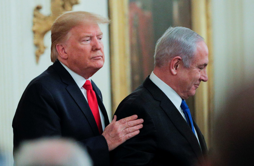 U.S. President Donald Trump and Israel's Prime Minister Benjamin Netanyahu appear together at a joint news conference to discuss a new Middle East peace plan proposal in the East Room of the White House in Washington, U.S. (photo credit: REUTERS/BRENDAN MCDERMID)