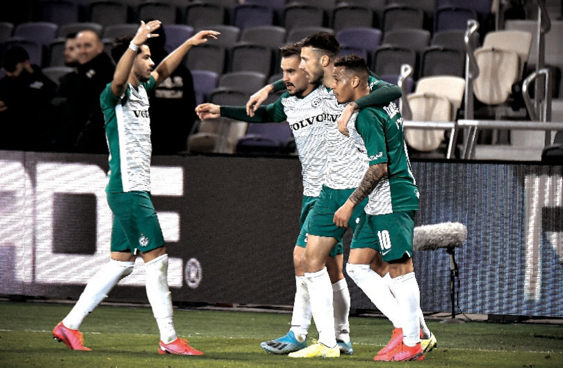 MACCABI HAIFA continues to keep the pressure on the Maccabi Tel Aviv 20 games into the Premier League season, in a title race that could go down to the wire. (photo credit: ARIEL SHALOM)