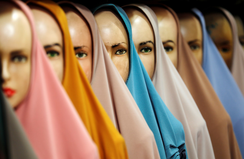 Hijabs for sale are pictured at a stall of Tanah Abang textile market in Jakarta (photo credit: REUTERS)