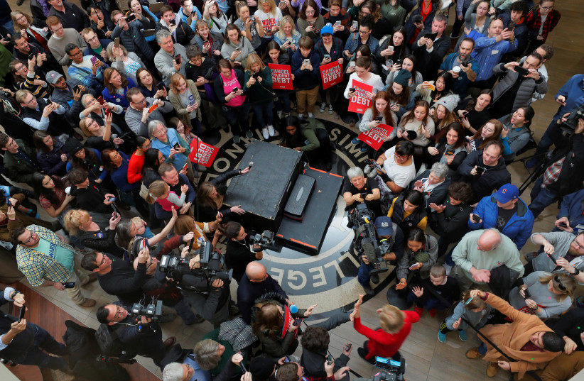 Democratic 2020 U.S. presidential candidate and U.S. Senator Elizabeth Warren (D-MA) arrives to address the overflow crowd at a Get Out the Caucus rally in Indianola, Iowa, U.S., February 2, 2020 (photo credit: REUTERS/BRIAN SNYDER)