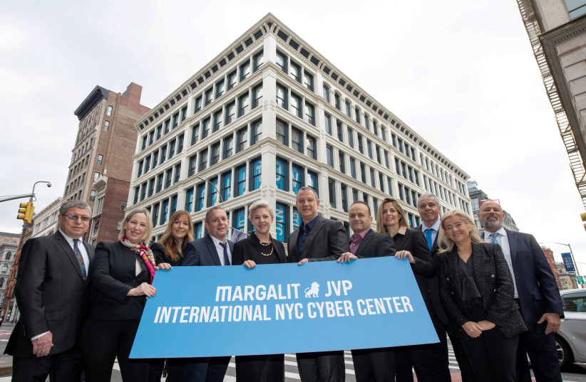 Jerusalem Venture Partners founder and executive chairman Dr. Erel Margalit (center) and executives outside the firm's International NYC Cyber Center.  (photo credit: SHAHAR AZRAN)