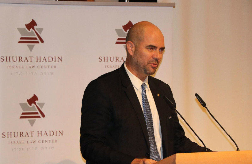 Acting Justice Minister Amir Ohana speaks at a Shurat Hadin conference, Jerusalem, February 5, 2020  (credit: YONAH JEREMY BOB)