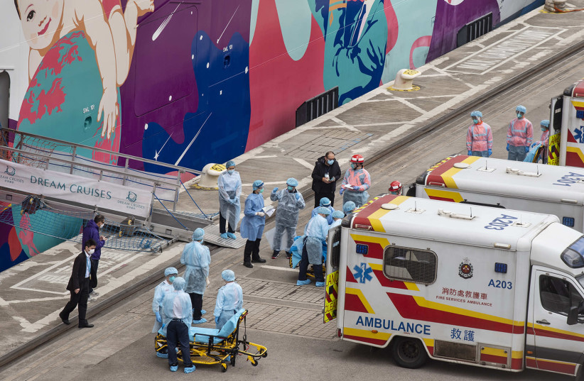 Medical staff prepares to treat passengers while the World Dream cruiser is docked at the Kai Tak Cruise Terminal, Hong Kong on Feb. 5, 2020. (photo credit: MIGUEL CANDELA/SOPA IMAGES VIA ZUMA WIRE/TNS)