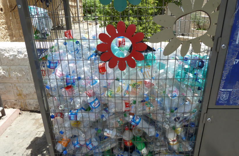 A PLASTIC bottle recycling cage in the Musrara neighborhood. (credit: Wikimedia Commons)