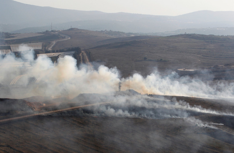 Smoke rises along the border with Lebanon during fighting in September 2019 (photo credit: REUTERS)