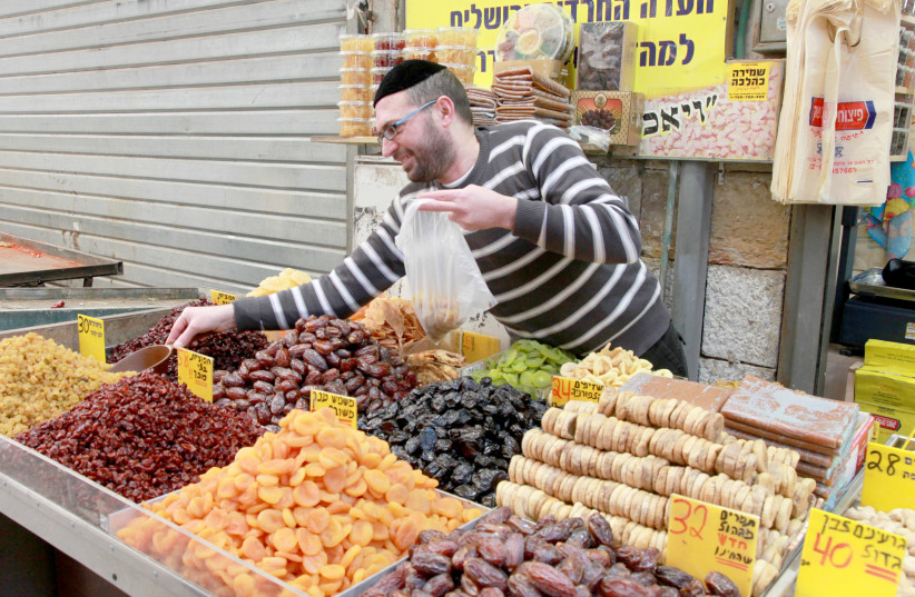 Overflowing bounty at Jerusalem's Mahaneh Yehuda market. (photo credit: MARC ISRAEL SELLEM)