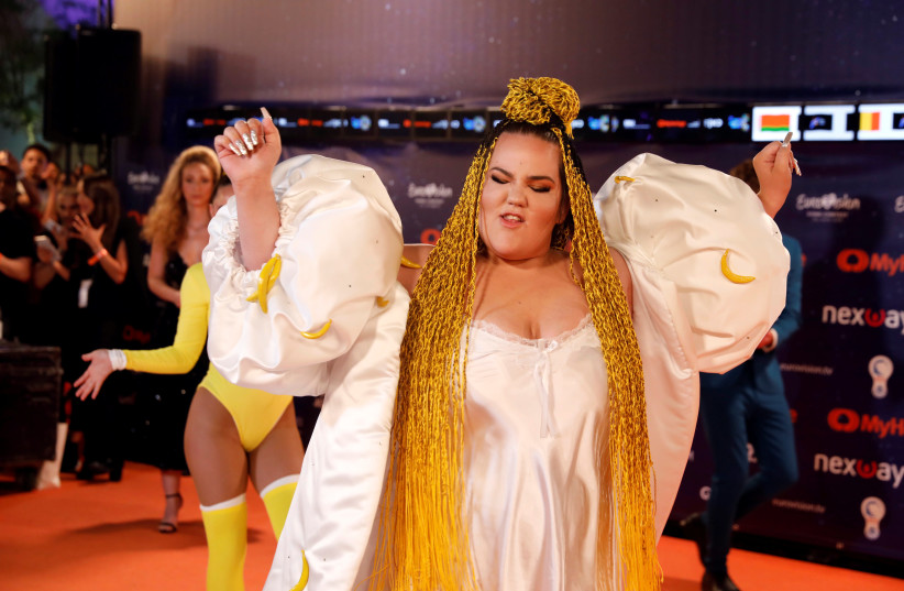 Winner of the 2018 Eurovision Song Contest, Netta Barzilai of Israel, takes part at the "Orange Carpet" opening ceremony of the 2019 Eurovision Song Contest in Tel Aviv, Israel May 12, 2019. (photo credit: AMIR COHEN/REUTERS)
