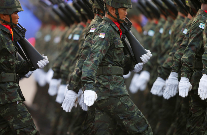 Soldiers march during the annual Military Parade to celebrate the Coronation of King Rama X at the Royal Thai Army Cavalry Center in Saraburi province, Thailand January 18, 2020 (credit: REUTERS/SOE ZEYA TUN)