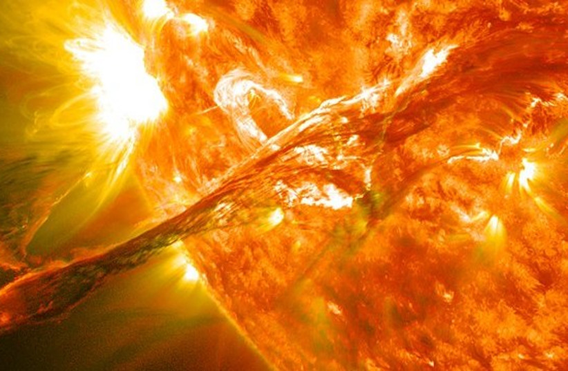 A coronal mass ejection erupting on the Sun's surface (photo credit: WIKIPEDIA)