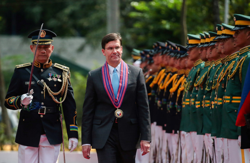 U.S. Secretary of Defense Mark Esper marches beside Lieutenant General Ramiro Ray during a welcoming ceremony at a military headquarters, Camp Aguinaldo in Quezon City, Metro Manila (photo credit: REUTERS)