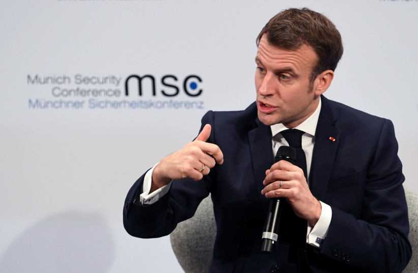 French President Emmanuel Macron speaks during a panel discussion at the annual Munich Security Conference in Germany February 15, 2020 (photo credit: ANDREAS GEBERT/REUTERS)