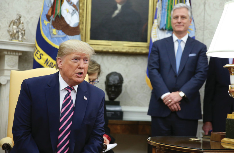 US PRESIDENT Donald Trump speaks as National Security Advisor Robert O’Brien listens in the Oval Office in December. (photo credit: OLIVER CONTRERAS/SIPA USA/TNS)