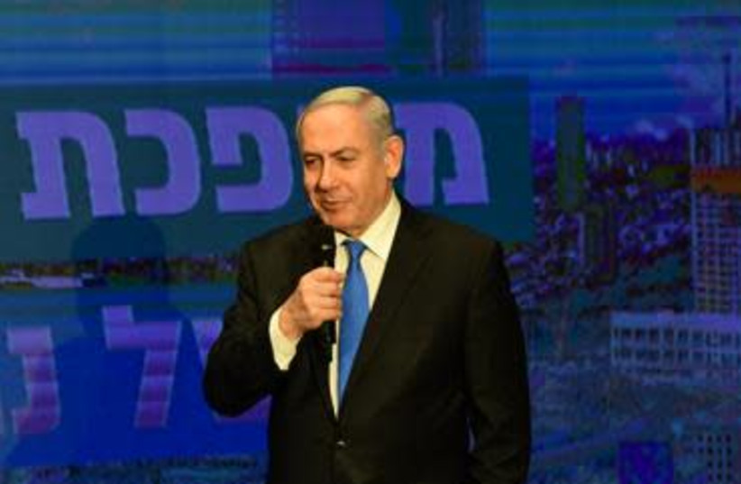 Prime Minister Benjamin Netanyahu and would-be finance minister Nir Barkat presented their vision for the Israeli economy under continued Likud governance on Sunday February 16 (photo credit: AVSHALOM SASSONI)