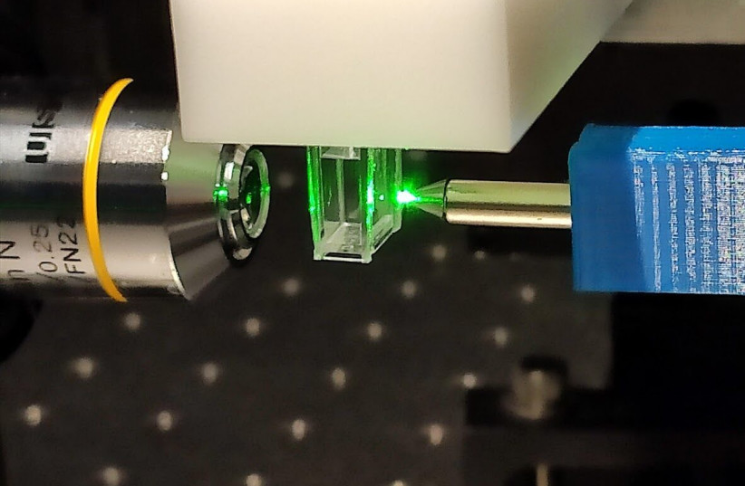 A laser with a magnet employed by Amos Danielli’s team for quick analysis of saliva samples testing for coronavirus.  (photo credit: BAR ILAN UNIVERSITY)