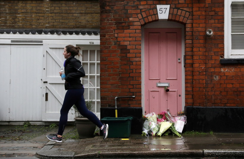 Flowers lie outside British television presenter Caroline Flack's old house in Islington, London (photo credit: REUTERS)