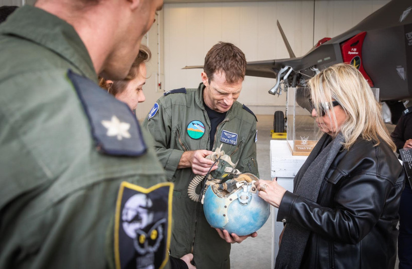 Ophira Gori [R], widow of IAF pilot Daniel Gori who perished during an accident in 1984, being given the helmet of her late husband after it was found.   (photo credit: IDF SPOKESPERSON'S OFFICE)