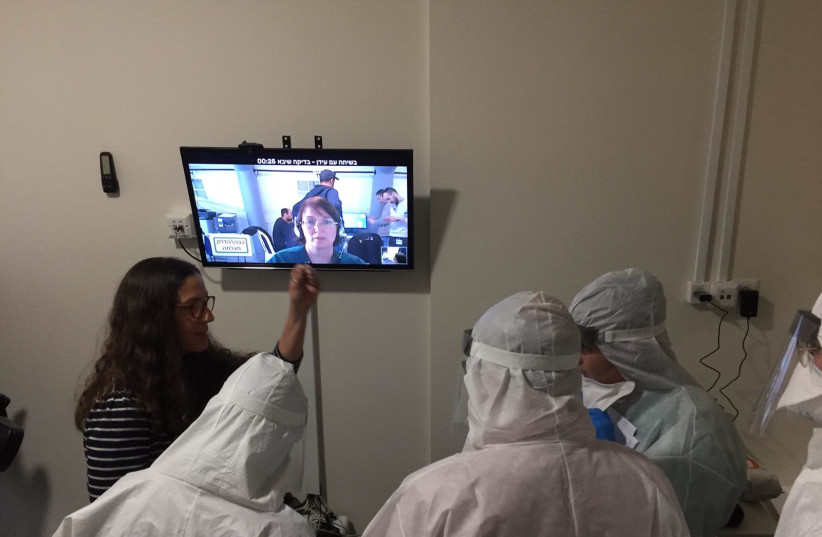 Head of Sheba Medical Center's telemedicine program Dr. Galia Barkai and others using Uniper Care technology. (photo credit: SHEBA MEDICAL CENTER)