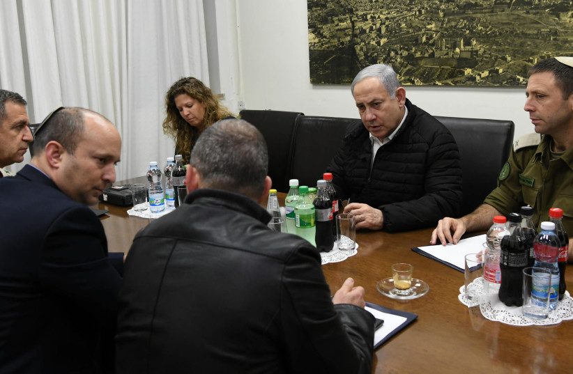 Prime Minister Benjamin Netanyahu holds a briefing with Defense Minister Naftali Bennett and IDF heads during the latest escalation with Gaza (photo credit: AMOS BEN-GERSHOM/GPO)
