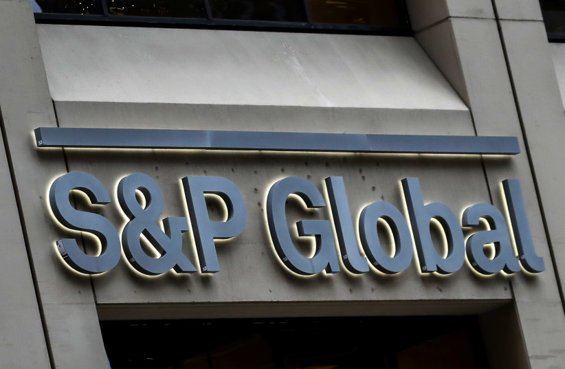 he S&P Global logo is displayed on its offices in the financial district in New York City, U.S. (photo credit: REUTERS/BRENDAN MCDERMID)