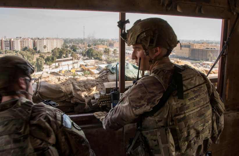 US Army soldiers keep watch on the US embassy compound in Baghdad, Iraq January 1, 2020 (credit: DOD/LT. COL. ADRIAN WEALE/HANDOUT VIA REUTERS)