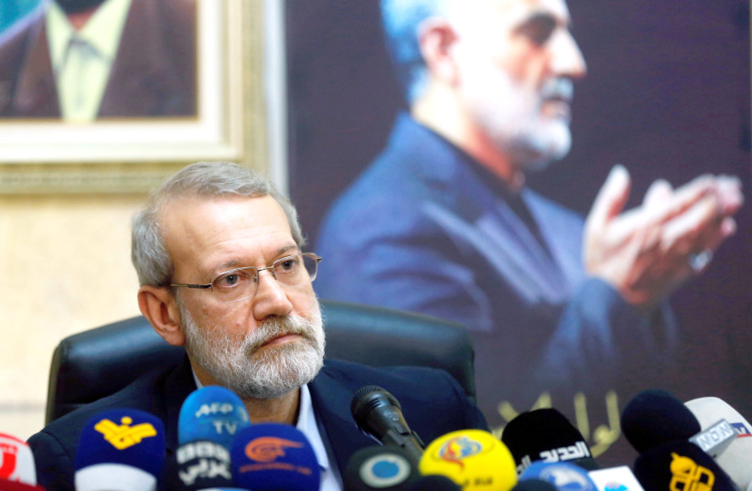 IRANIAN PARLIAMENT speaker Ali Larijani attends a news conference at the Iranian Embassy in Beirut’s southern suburbs, as a picture of late Iranian Quds Force top commander Qasem Soleimani is seen in the background, on February 17.  (photo credit: REUTERS)