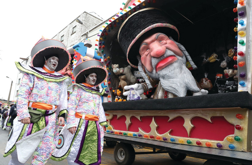 A FLOAT with an effigy of a Jew is seen during the carnival at Aalst, Belgium, on February 23. (photo credit: YVES HERMAN / REUTERS)