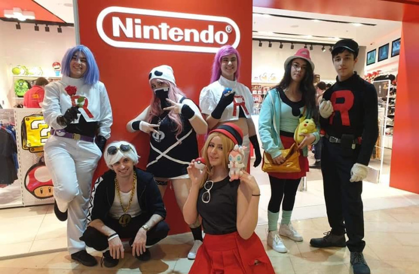 Fans dress up in cosplay for International Pokemon Day outside the Nintendo store in Dizengoff Center, Tel Aviv. (photo credit: GILL SHALEV)