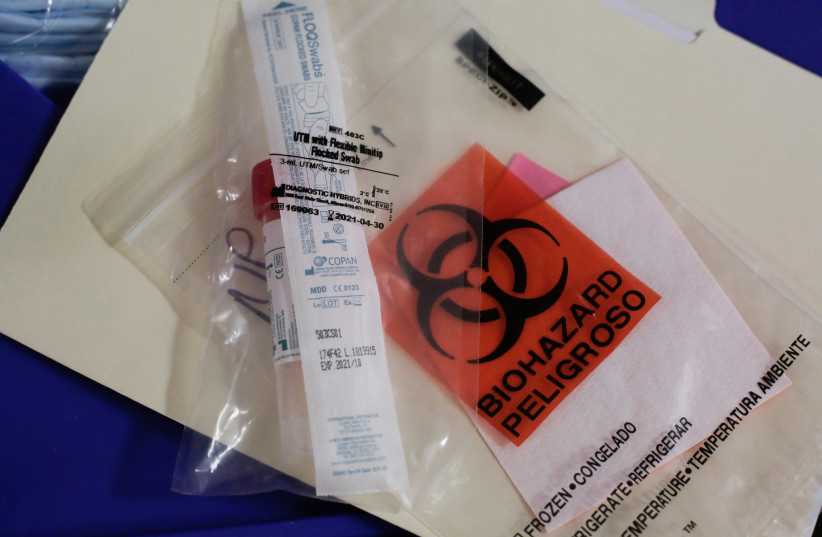 A swab to be used for testing novel coronavirus (photo credit: REUTERS/DAVID RYDER)