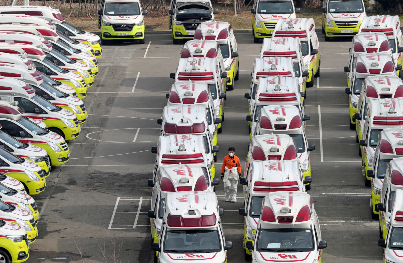 Ambulances to transport coronavirus infected patients are parked in Daegu, South Korea, March 1, 2020 (photo credit: REUTERS)