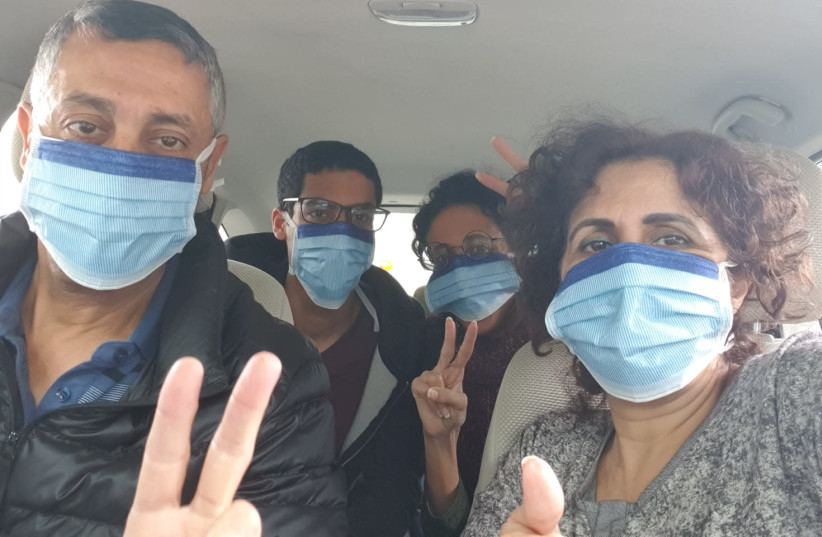 The Kochavi family, under quarantine until Thursday, goes to vote at a coronavirus voting booth in the Knesset elections on March 2 (photo credit: KOCHAVI FAMILY)