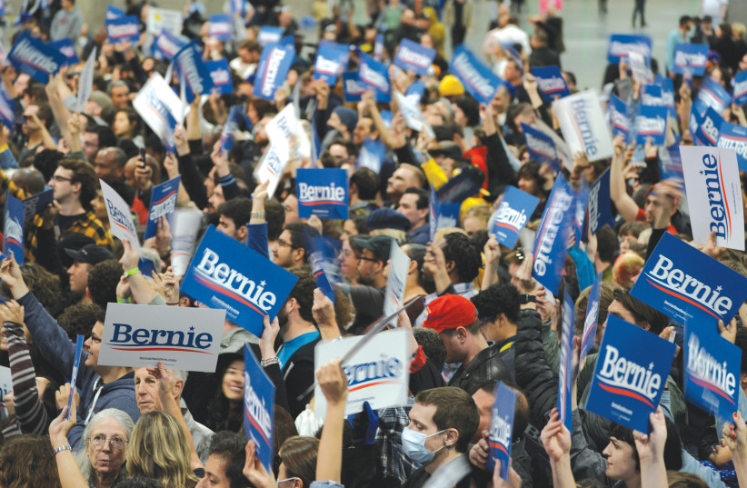 SUPPORTERS OF DEMOCRATIC 2020 US presidential candidate Senator Bernie Sanders wave signs during a campaign rally in Los Angeles, Sunday. (photo credit: KYLE GRILLOT/REUTERS)