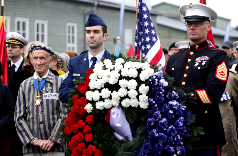 Concentration camp survivor Ed Mosberg and a delegation from the U.S. attend the commemoration at the former concentration camp KZ Mauthausen, liberated by U.S. troops on May 5, 1945 at the memorial site in Mauthausen, Austria, May 5, 2019. (photo credit: REUTERS)