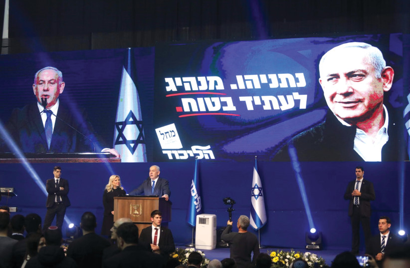 PRIME MINISTER Benjamin Netanyahu celebrates Monday night. Now the work begins. (photo credit: MARC ISRAEL SELLEM/THE JERUSALEM POST)
