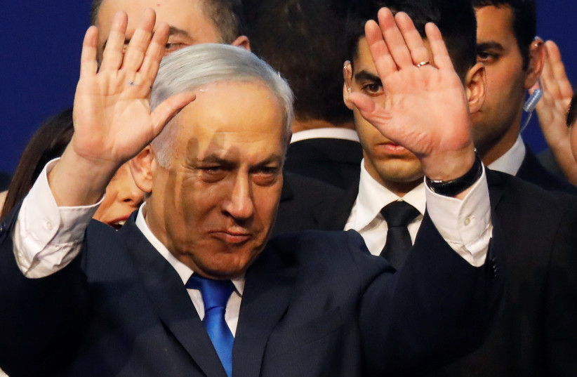 Israeli Prime Minister Benjamin Netanyahu gestures after speaking to supporters following the announcement of exit polls in Israel's election at his Likud party headquarters in Tel Aviv, Israel March 3, 2020 (photo credit: REUTERS/AMIR COHEN)