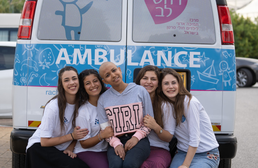 EIGHTEEN-YEAR-OLD  Stav with her national service volunteers, traveling to the hospital for treatment in the Rachashei Lev Dream ambulance.  (photo credit: DANIEL COHEN)