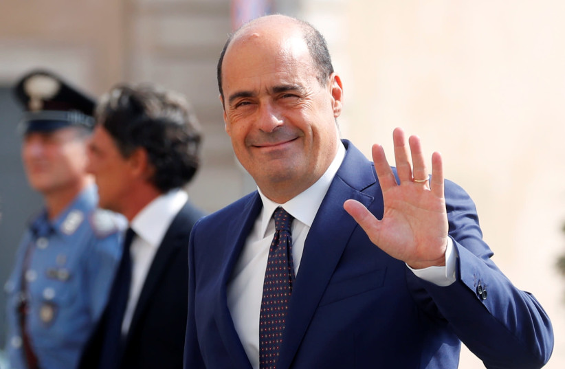 Democratic Party leader Nicola Zingaretti waves as he walks into the Presidential Palace for consultations with Italian President Sergio Mattarella in Rome, Italy, August 28, 2019 (photo credit: REUTERS/REMO CASILLI)